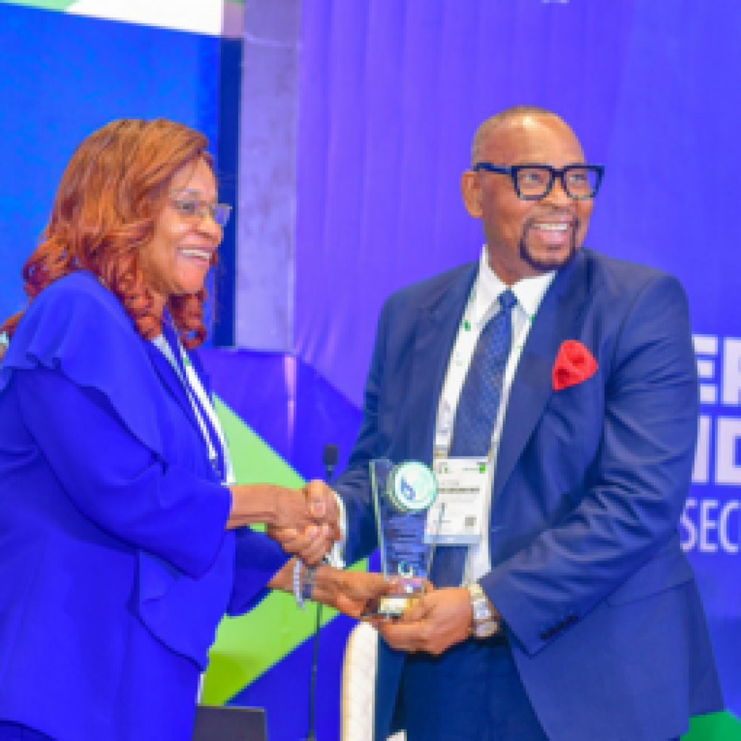 Receiving a plaque from Perm Sec Ministry of Petroleum